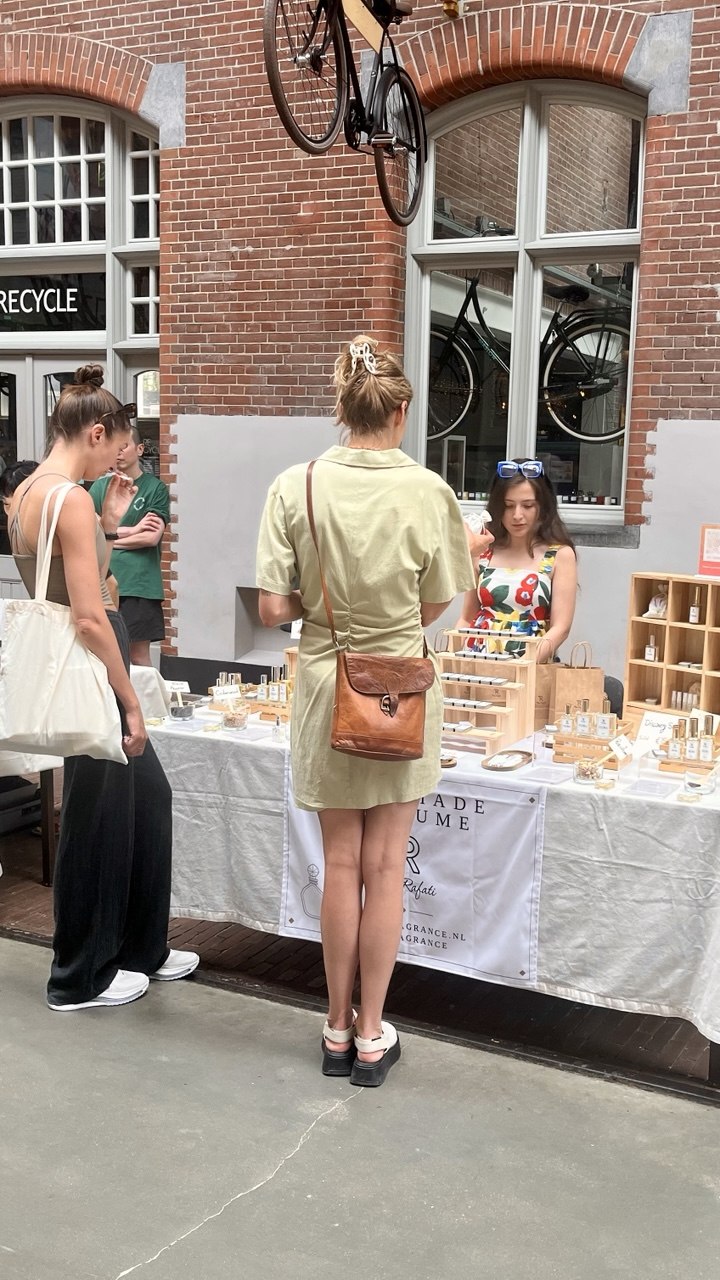 Tara serving customers at the TR Fragrance stall