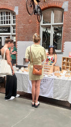 Tara serving customers at the TR Fragrance stall